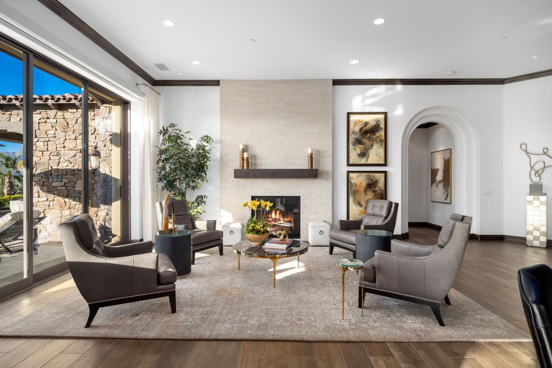 A living room filled with furniture and a fireplace.