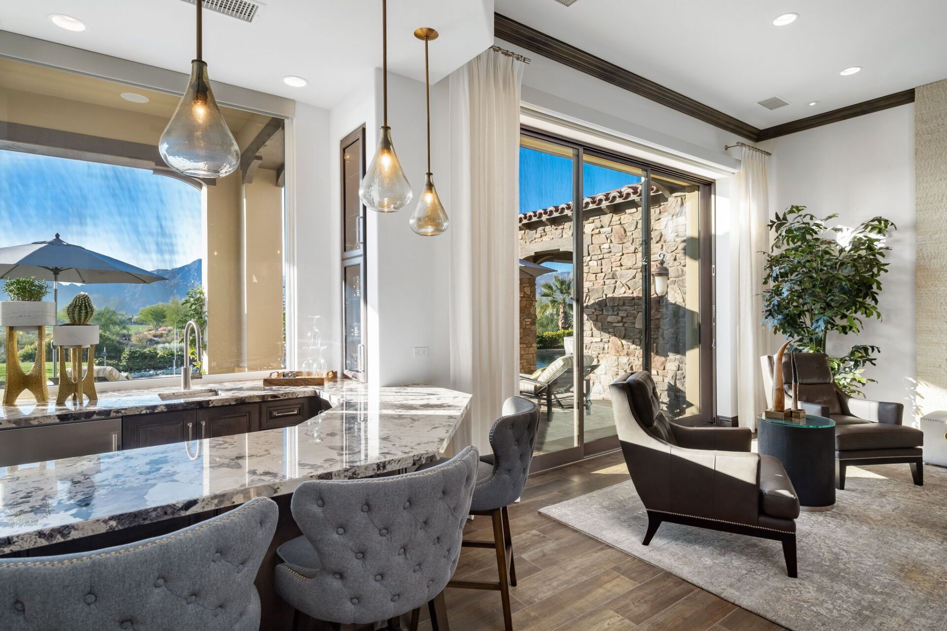 A living room with a sliding glass door leading to a patio.