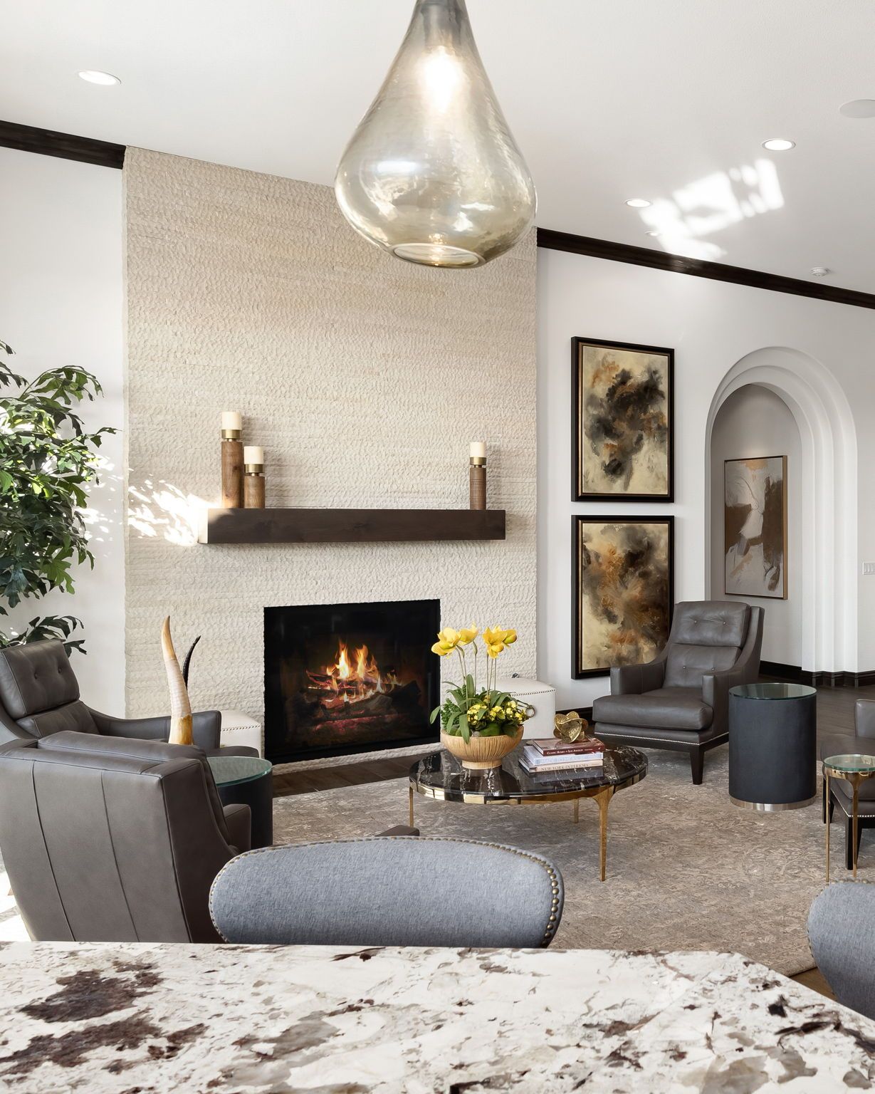 A living room with a fireplace and a table