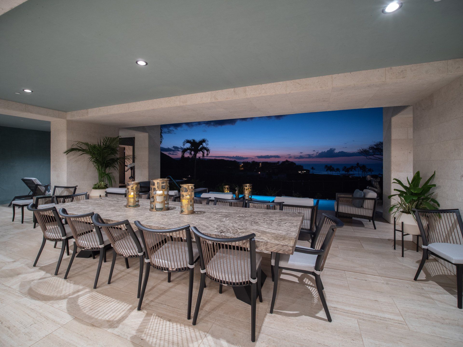 There is a large table and chairs in the middle of the room.