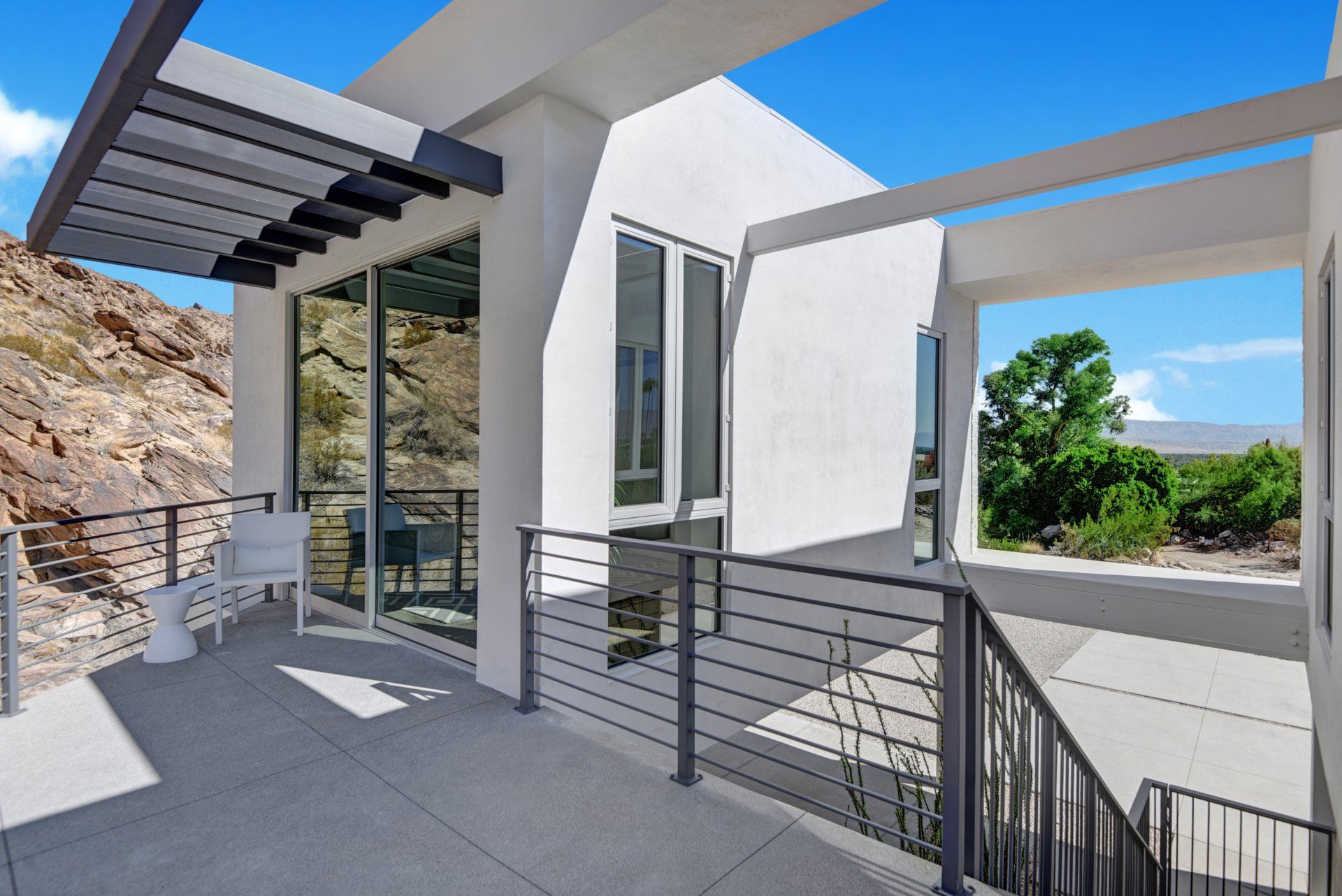 Screen House Palm Springs | Staircase to Carport