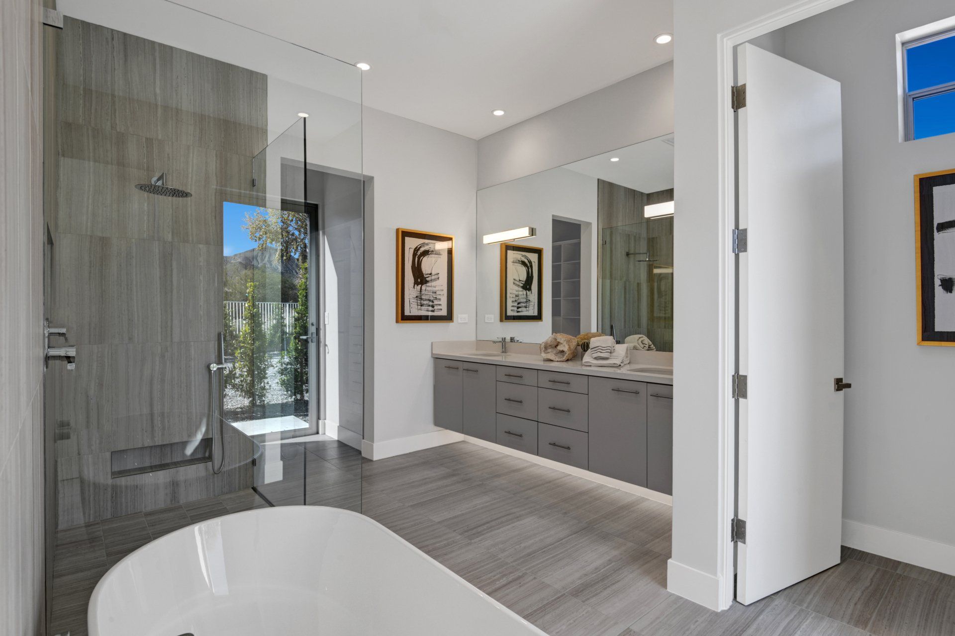 A bathroom with a bathtub and a walk in shower.