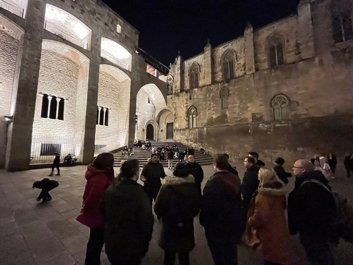 Barcelona Ghost Tour group at Plaça del Rei in the Gothic Quarter at night