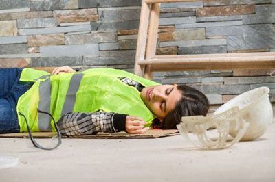 Woman on Ground at Workplace