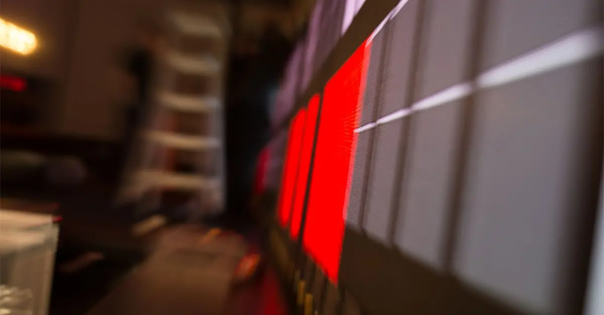 A close up of a tv screen with a red stripe on it.