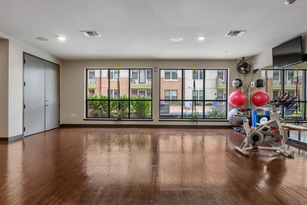 A spinning bike and exercise balls in the yoga room at The 704 in South Lamar Austin, TX.