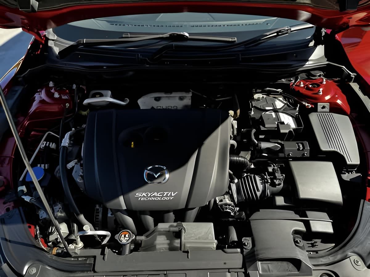 The Engine of a Red Car is Shown With the Hood Open — Silver Spanner Mechanics in Branyan, QLD