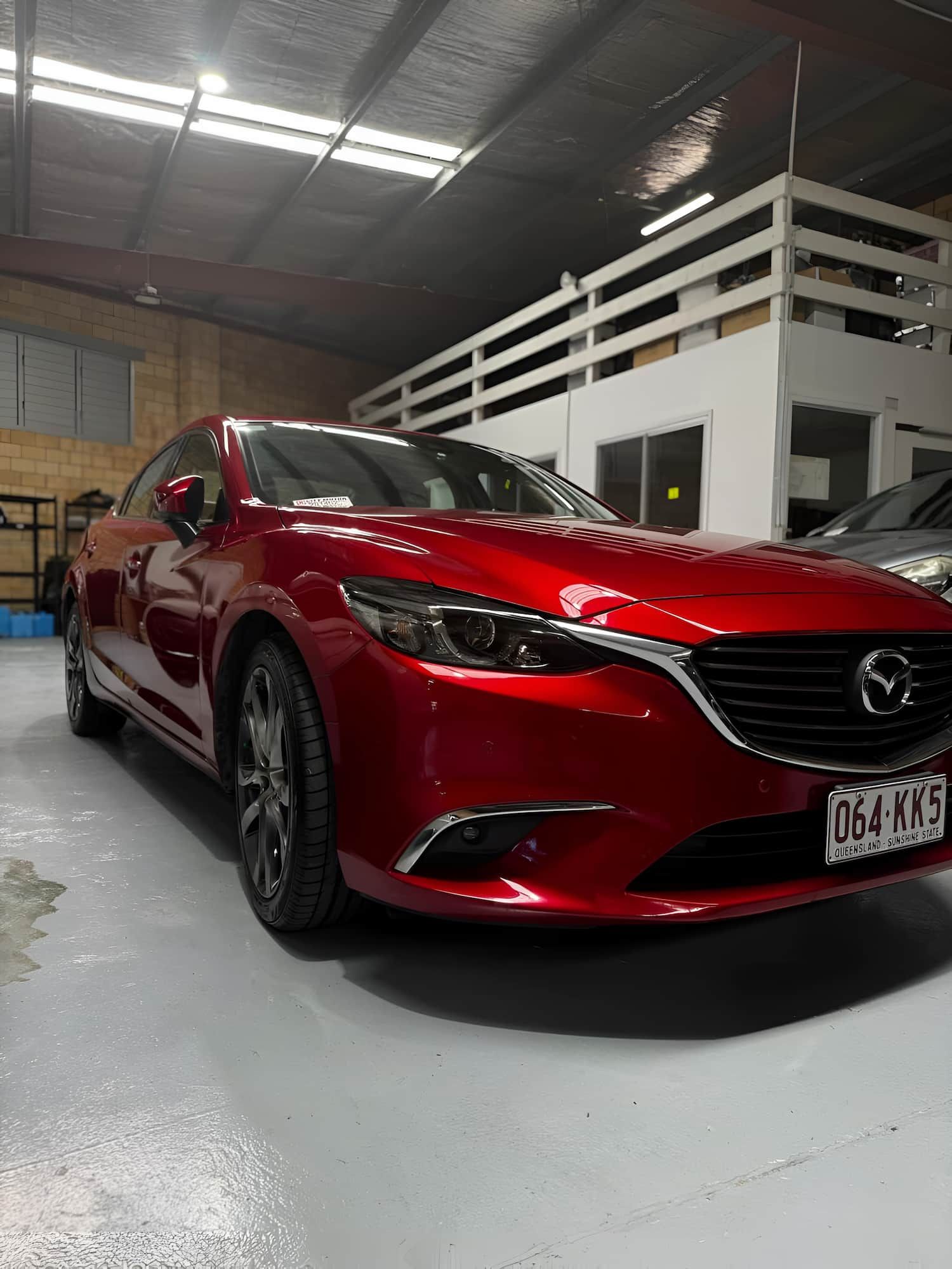 A Red Mazda 6 is Parked in a Garage — Silver Spanner Mechanics in Branyan, QLD