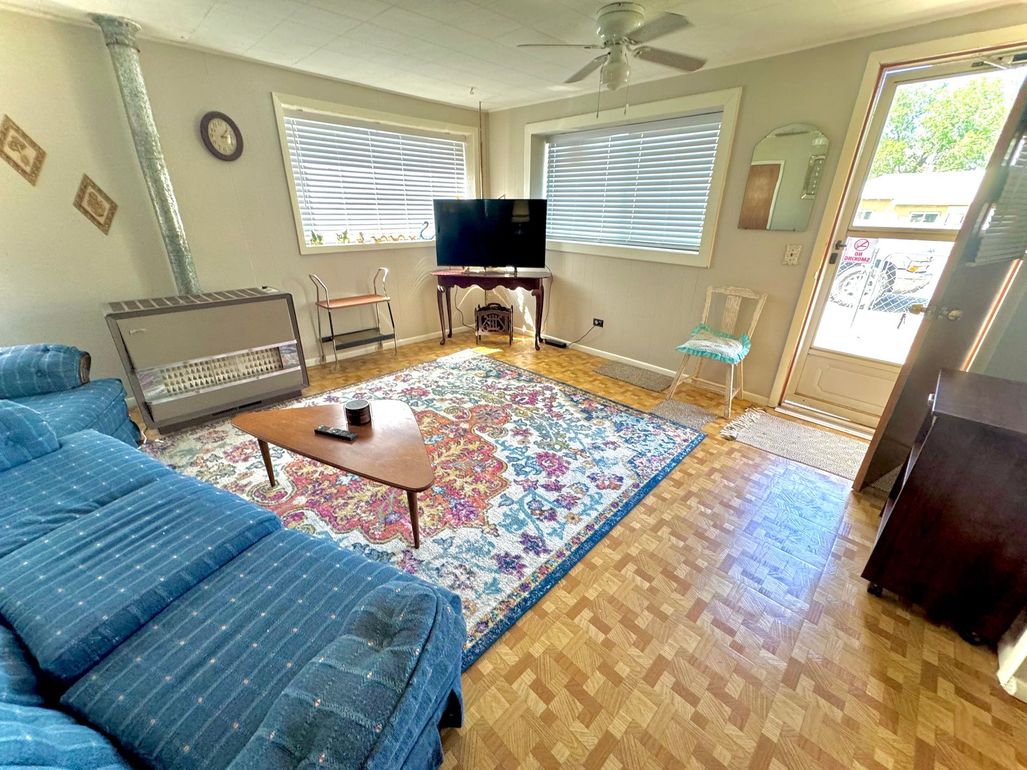 Cozy living room with couch TV and natural light at Stucco Casa