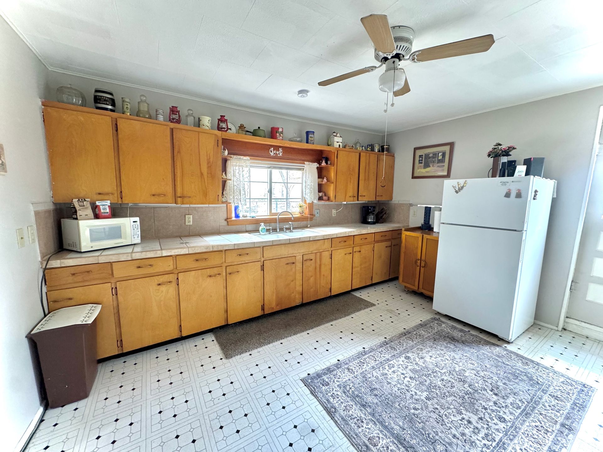 Full kitchen with stove refrigerator and cabinets at Stucco Casa