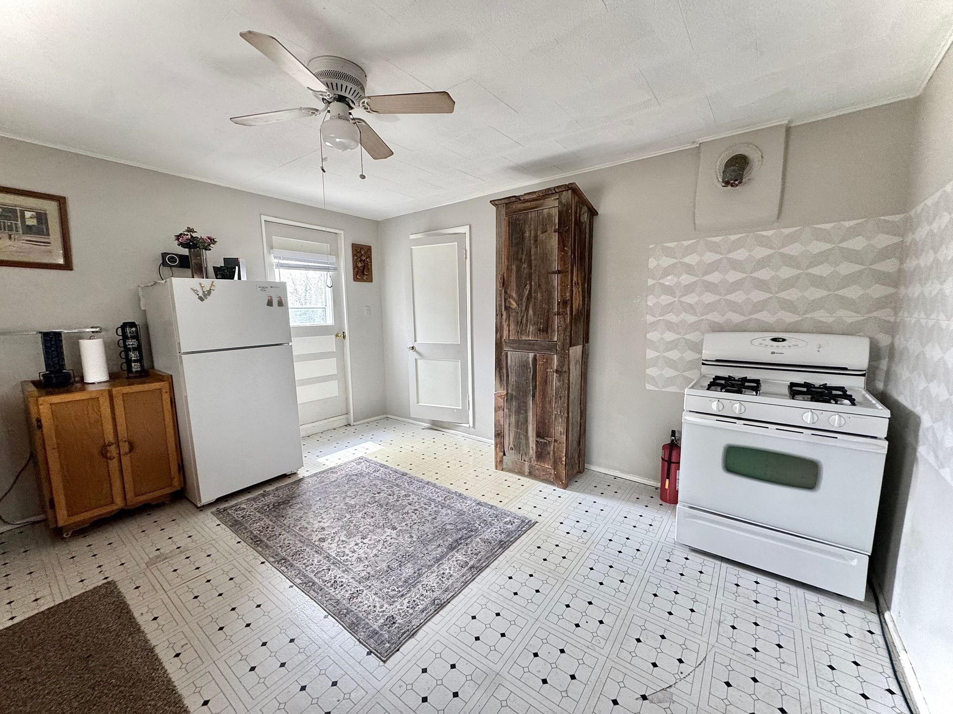 Kitchen with stove and entryway at Stucco Casa Antonito Colorado
