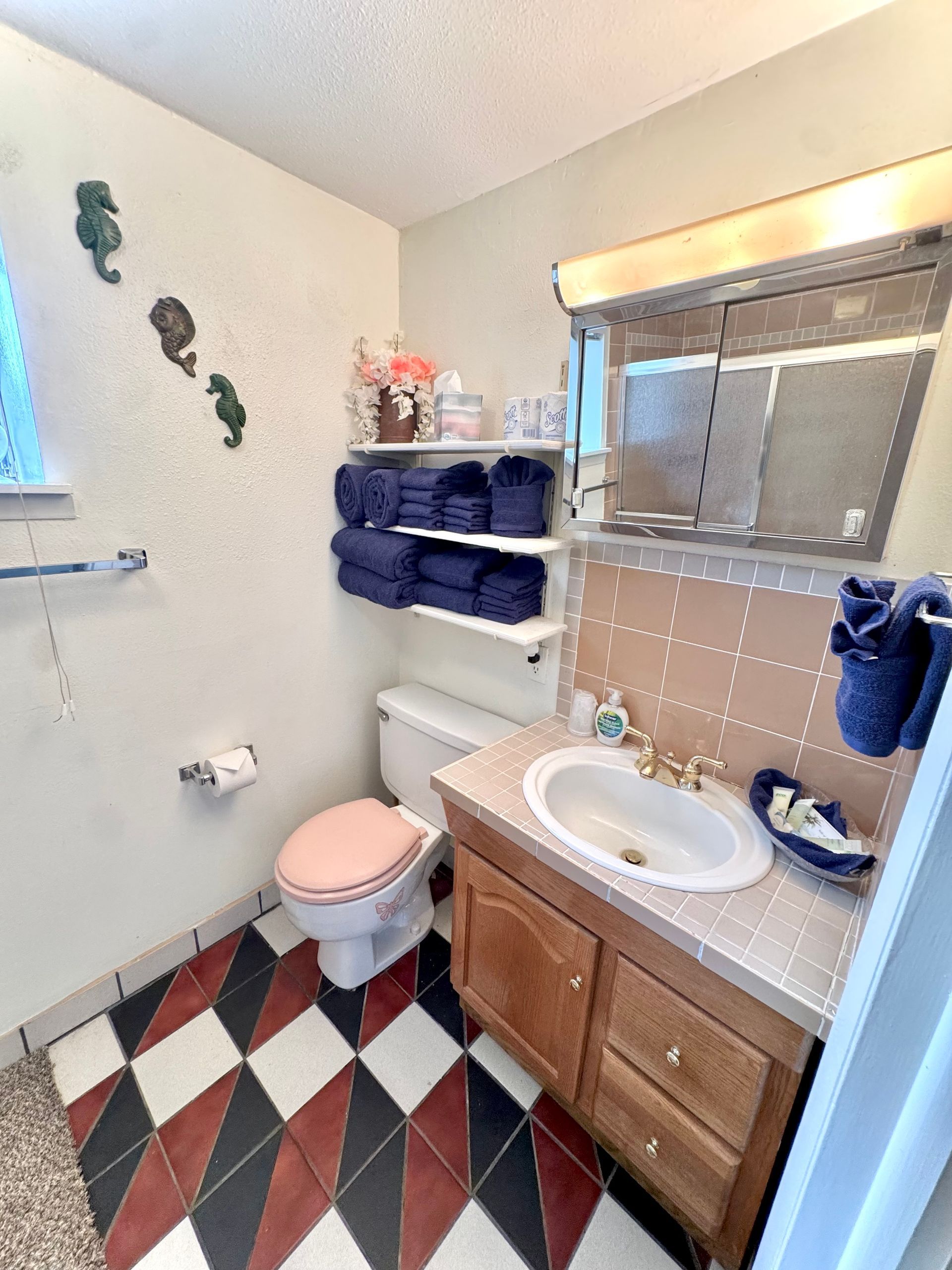 Bathroom with sink mirror and shower at Stucco Casa vacation rental