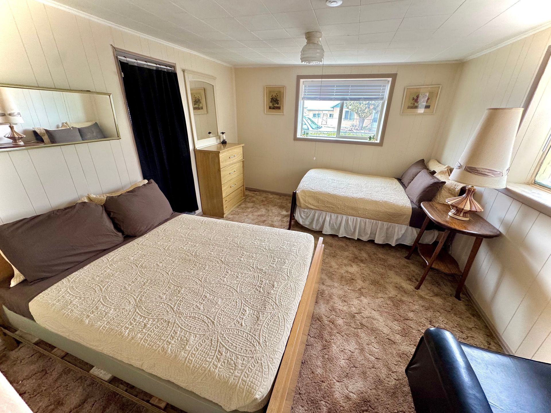 Bedroom with bed seating area and natural light at Stucco Casa