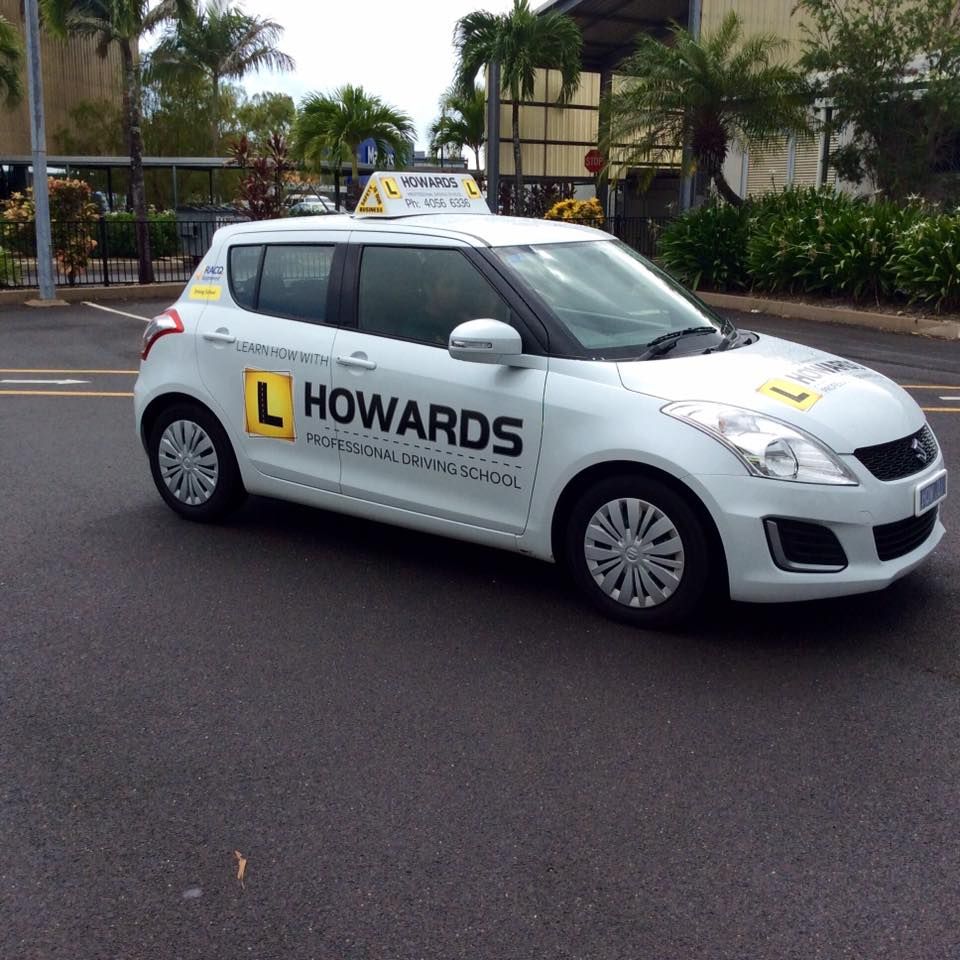 A White Car With the Word Howards on the Side — Howards Professional Driving School In Gordonvale, QLD