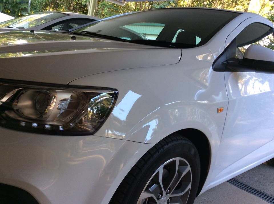 A White Car is Parked in a Parking Lot — Howards Professional Driving School In Cairns, QLD