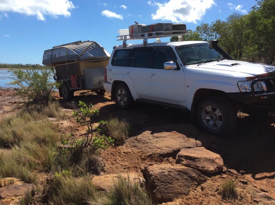 A White Suv With a Trailer Attached to It — Howards Professional Driving School In Innisfail, QLD