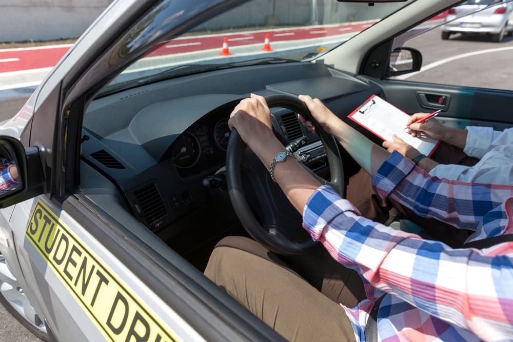 Student Driving Car With Instructor — Howards Professional Driving School In Gordonvale, QLD