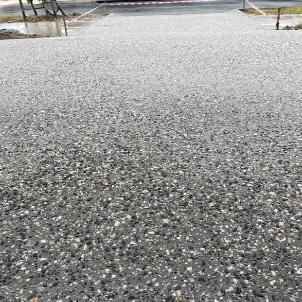 A Close Up of a Gravel Road With a Red Barrier in the Background — Construction 33 in Maroochydore, QLD