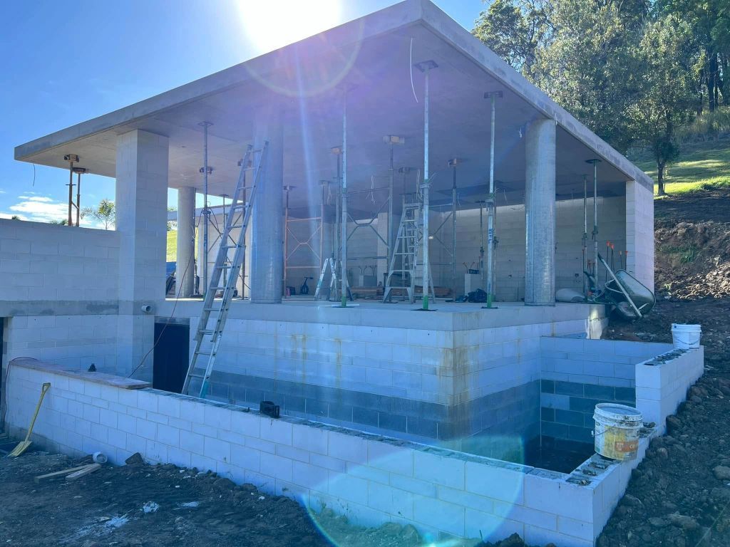 A Building Under Construction With a Pool in the Middle of It — Construction 33 in Coolum Beach, QLD