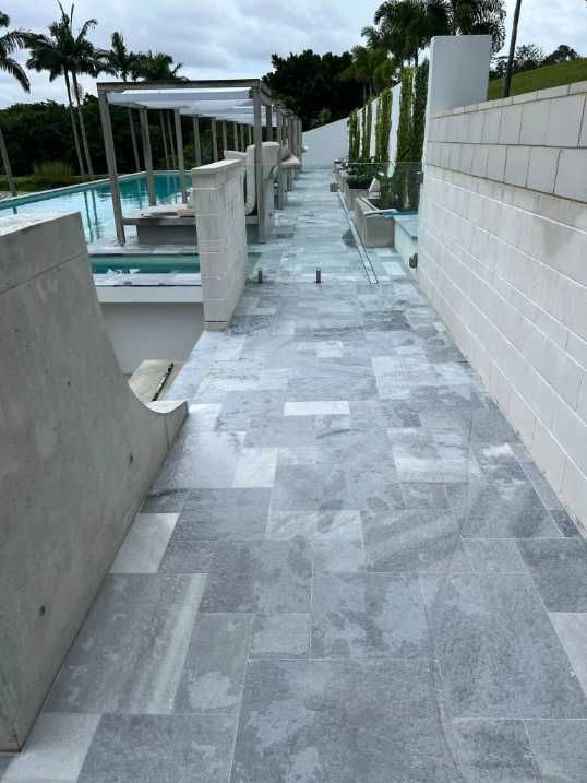A Walkway With a Swimming Pool in the Background — Construction 33 in Coolum Beach, QLD