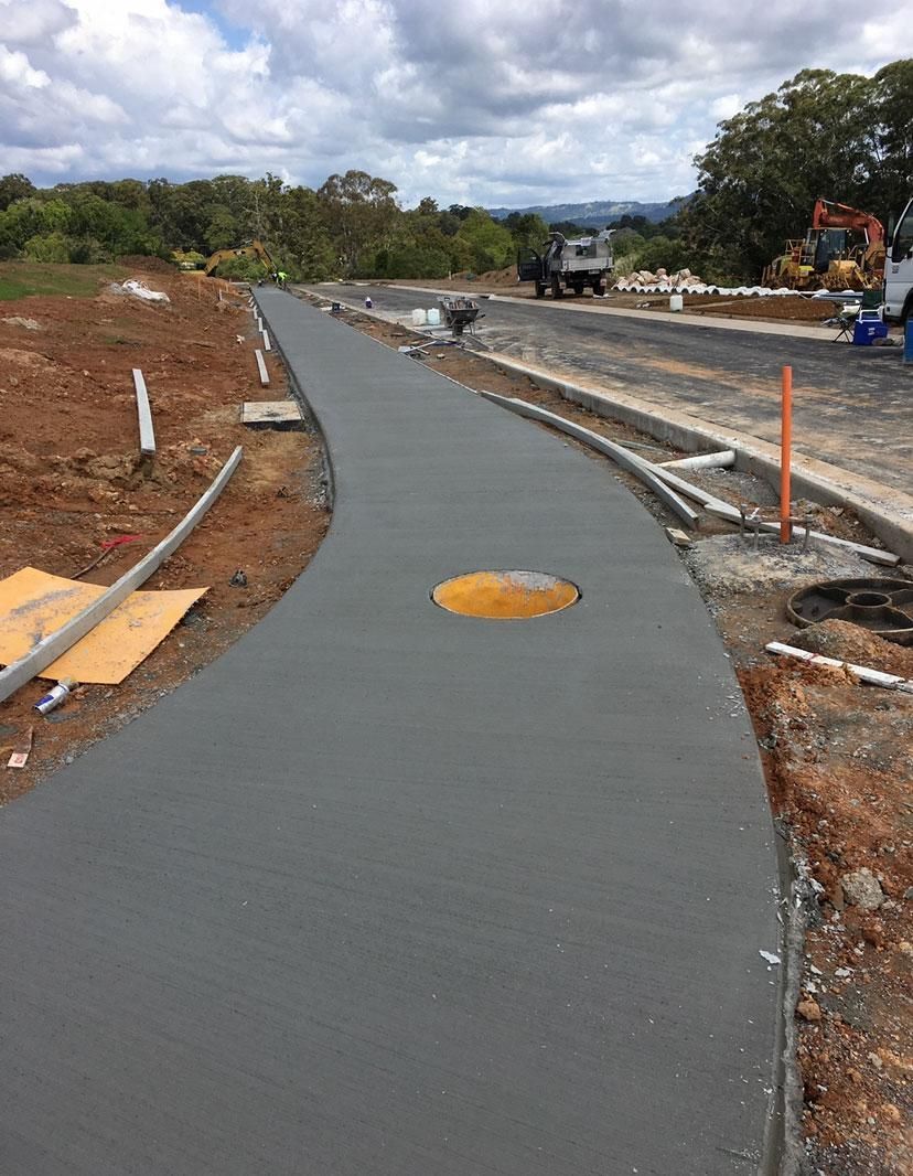 Concrete Walkway is Being Built on the Side of a Road — Construction 33 Concreting in Moreton Bay, QLD