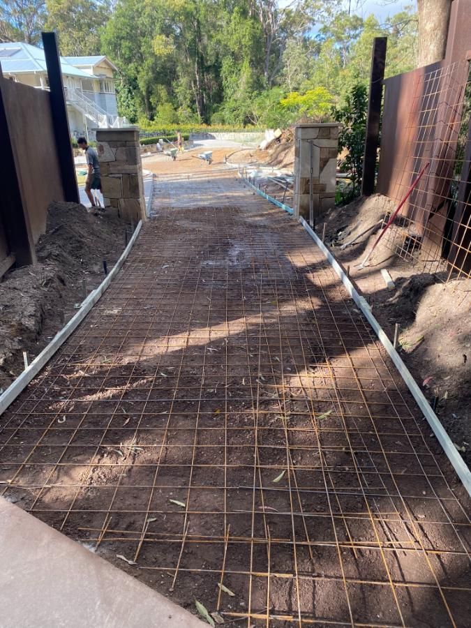 Concrete Walkway is Being Built Next to a Fence — Construction 33 in Noosa, QLD