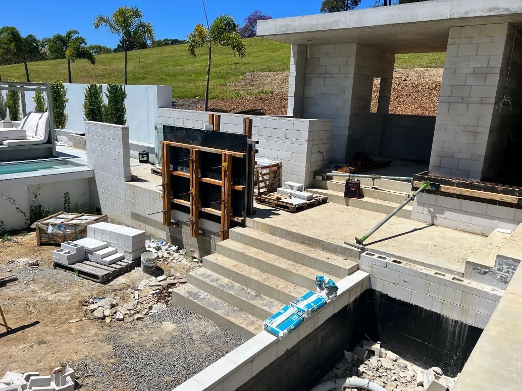 A Building Under Construction With a Pool in the Background — Construction 33 Concreting in Moreton Bay, QLD
