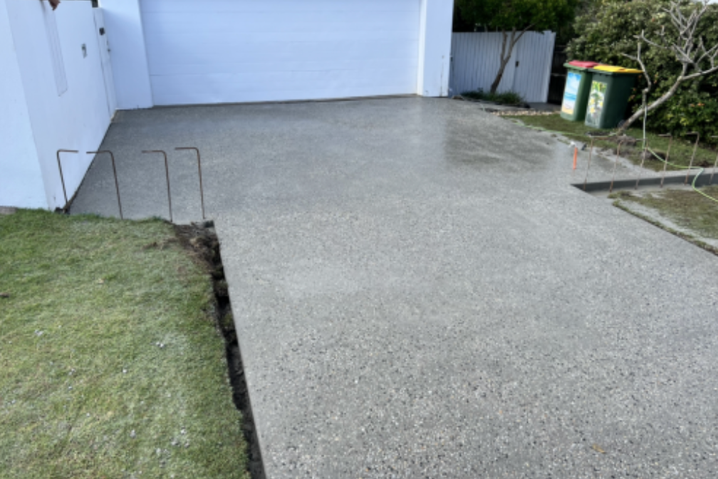 Concrete Walkway is Being Built Next to a Stone Wall — Construction 33 in Maroochydore, QLD