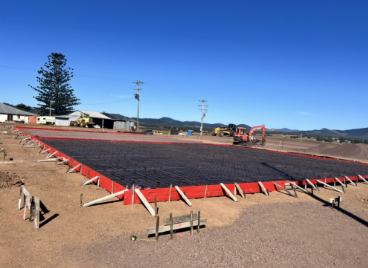 A Large Concrete Slab is Being Built on a Dirt Field — Construction 33 in Maroochydore, QLD