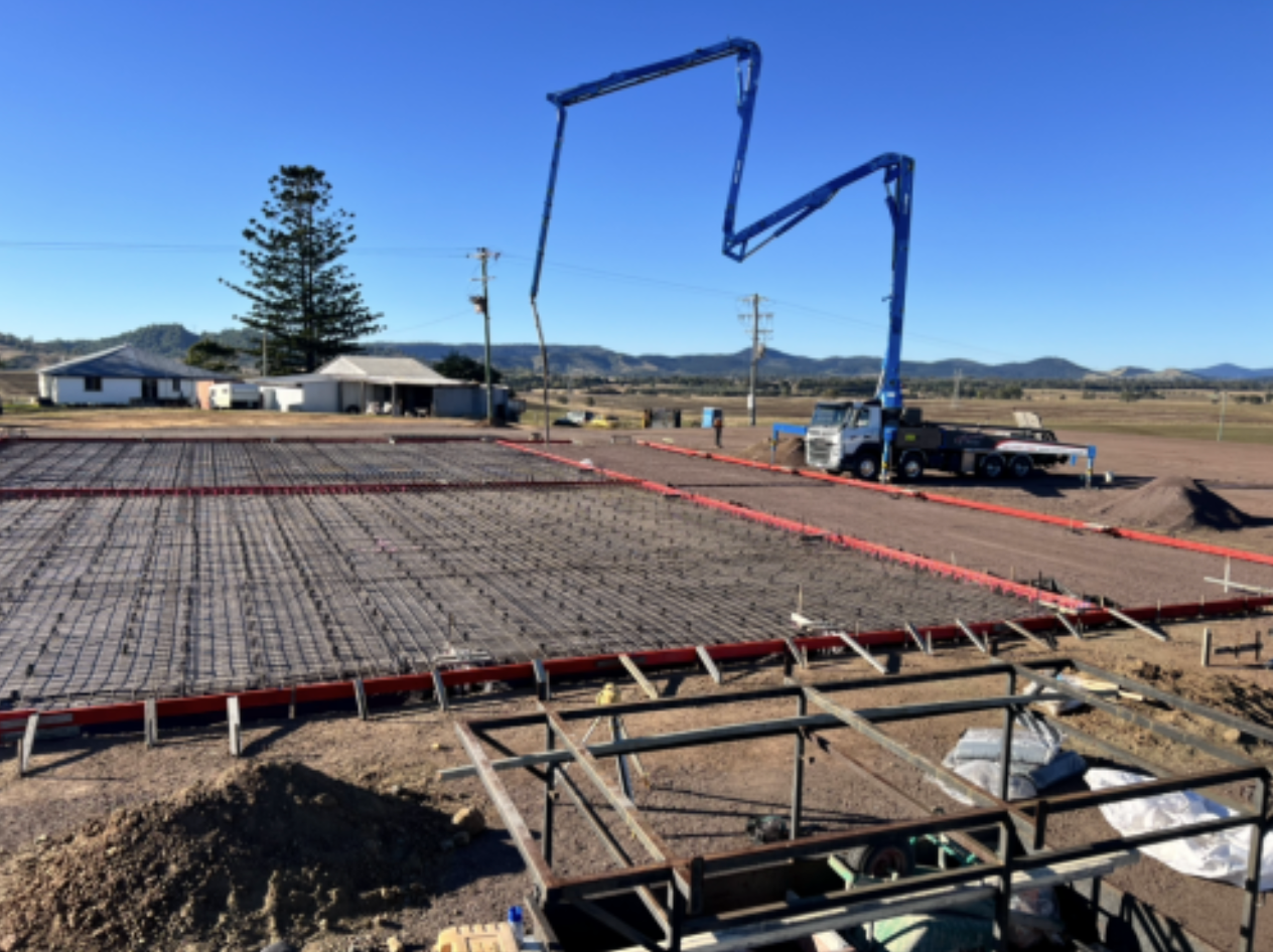 Concrete Pour at Construction Site With Pump Truck and Rebar Grid — Construction 33 in Maroochydore, QLD