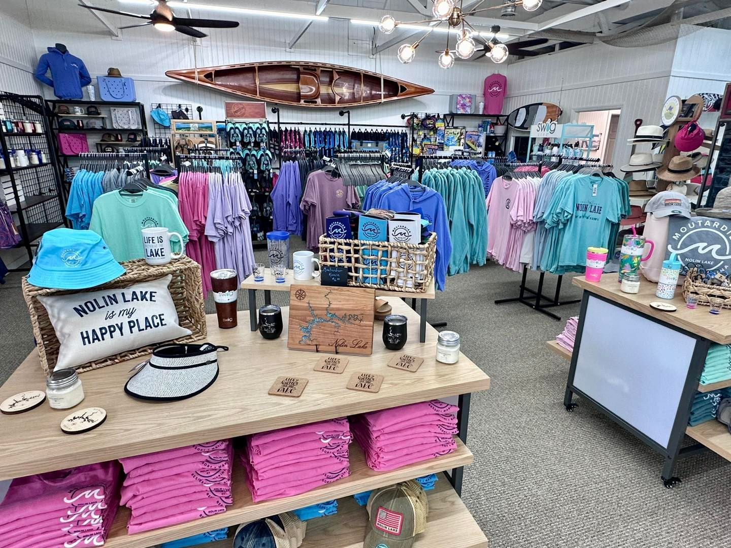 A store filled with lots of shirts and other items.