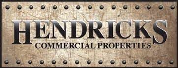 A sign that says hendricks commercial properties on it
