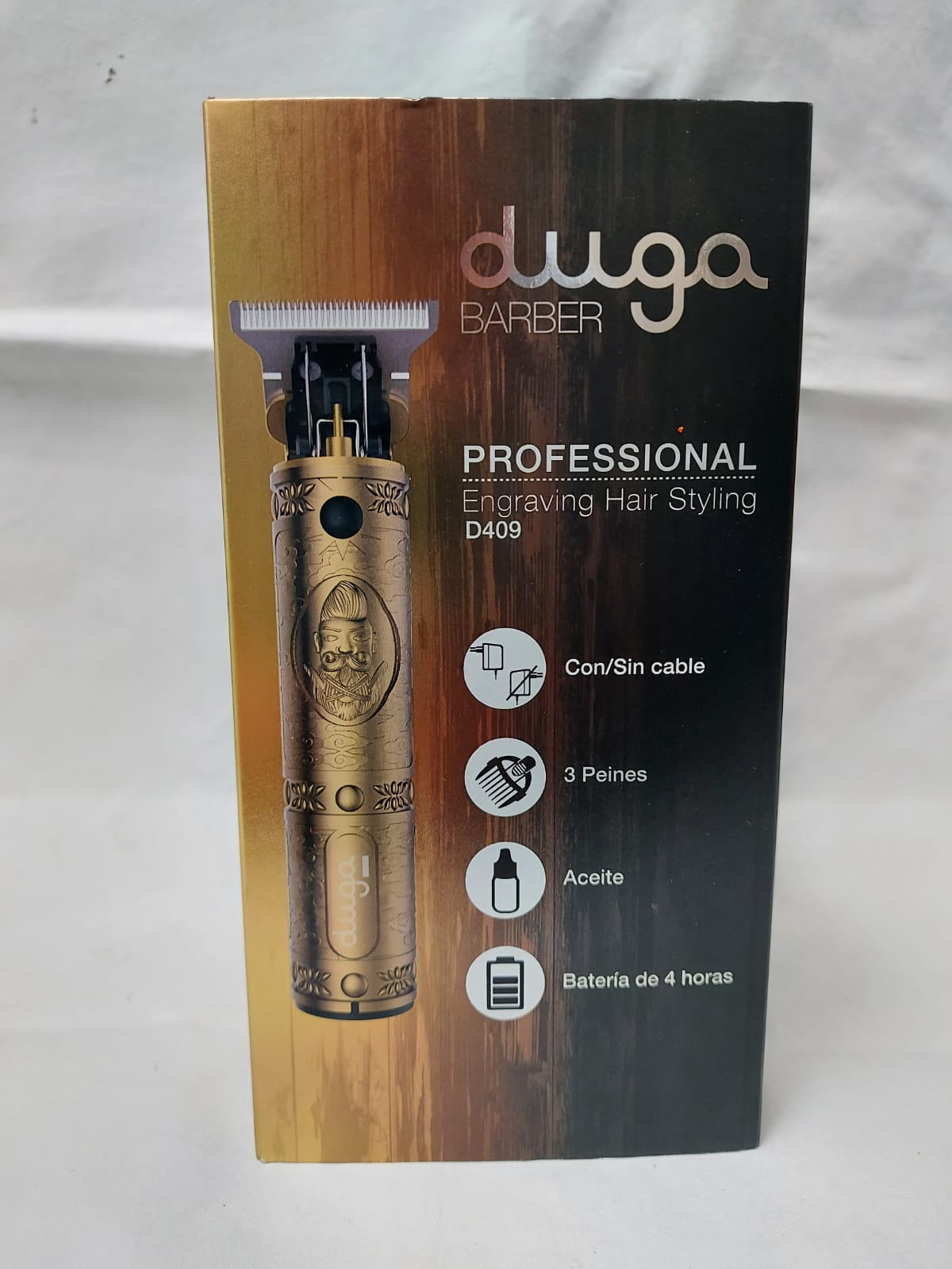 Caja de una cortadora de pelo Duga Barber dorada. Incluye una ilustración, la palabra