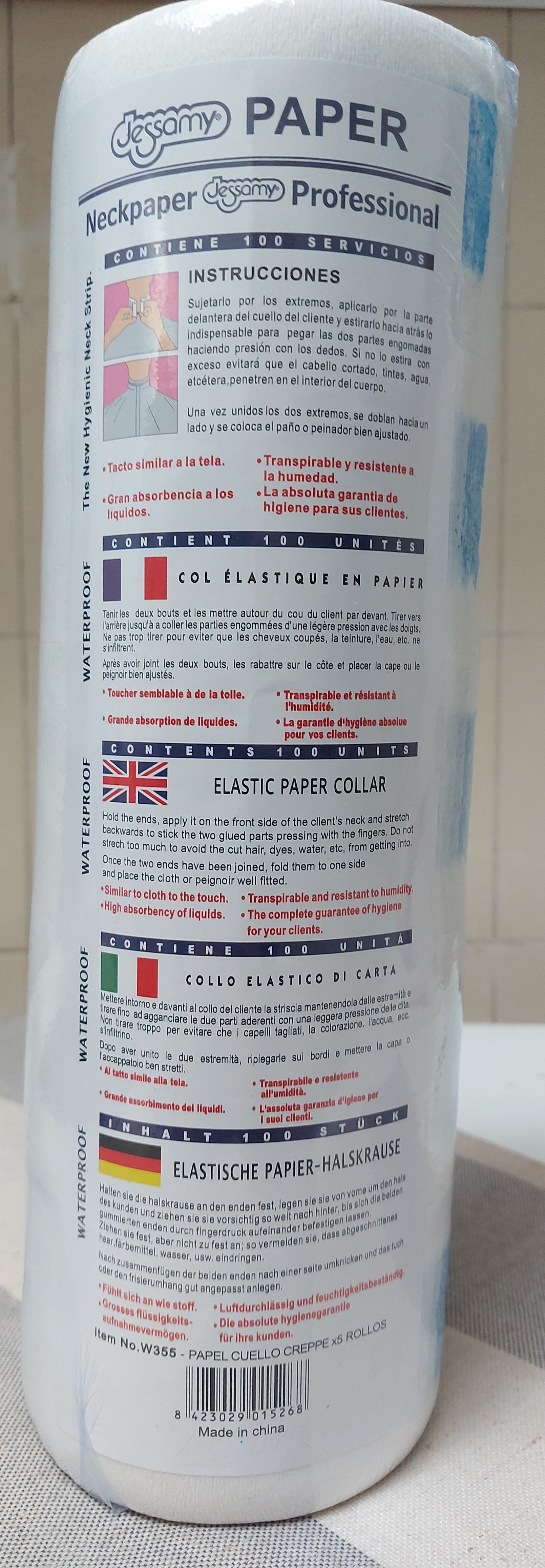 Rollo de papel blanco con texto en varios idiomas y banderas, incluidos francés, inglés, italiano y alemán.