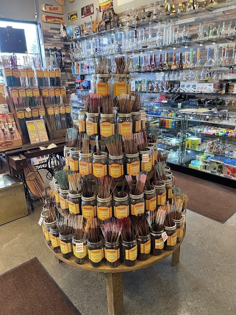 A table filled with jars of chocolates in a store.