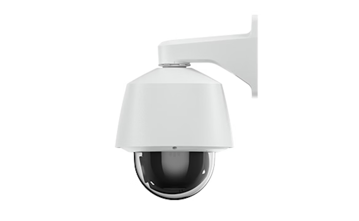 White security camera mounted on a wall bracket. Dome lens.