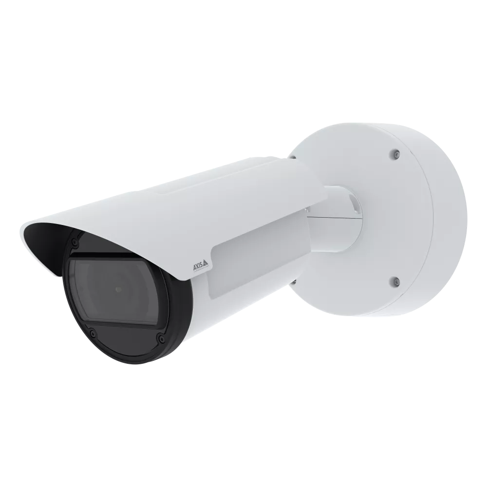 White security camera mounted on a wall.