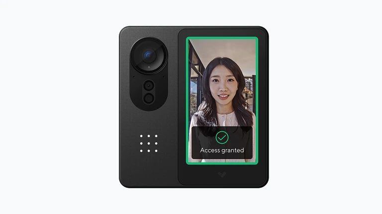 Black smart doorbell with camera and screen. Screen displays woman, access granted.