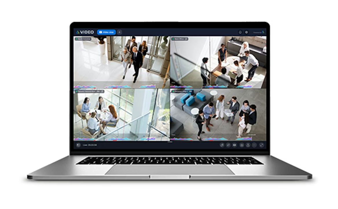 White security camera mounted on a wall.