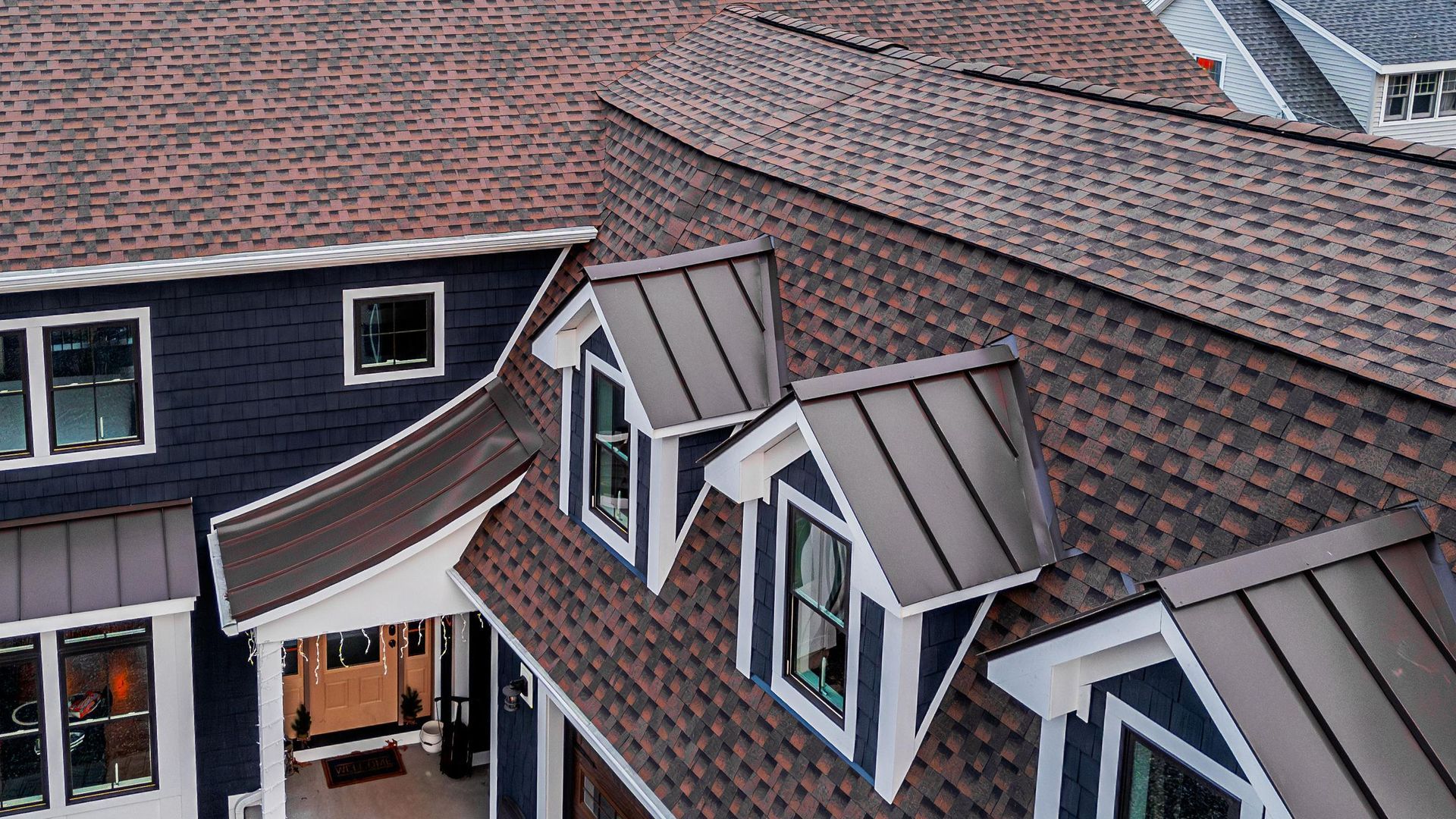 An aerial view of a house with a roof and windows.