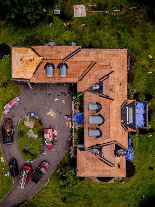 An aerial view of a large house under construction