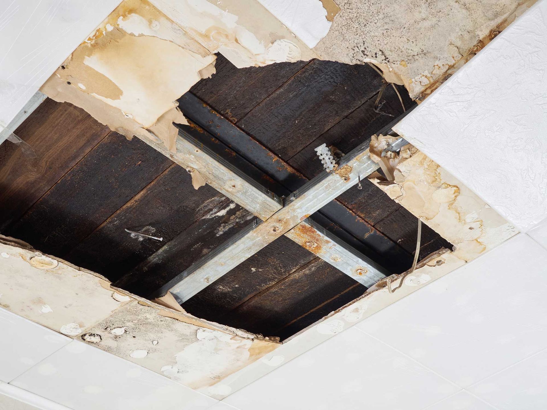 A ceiling with a hole in it that looks like a window