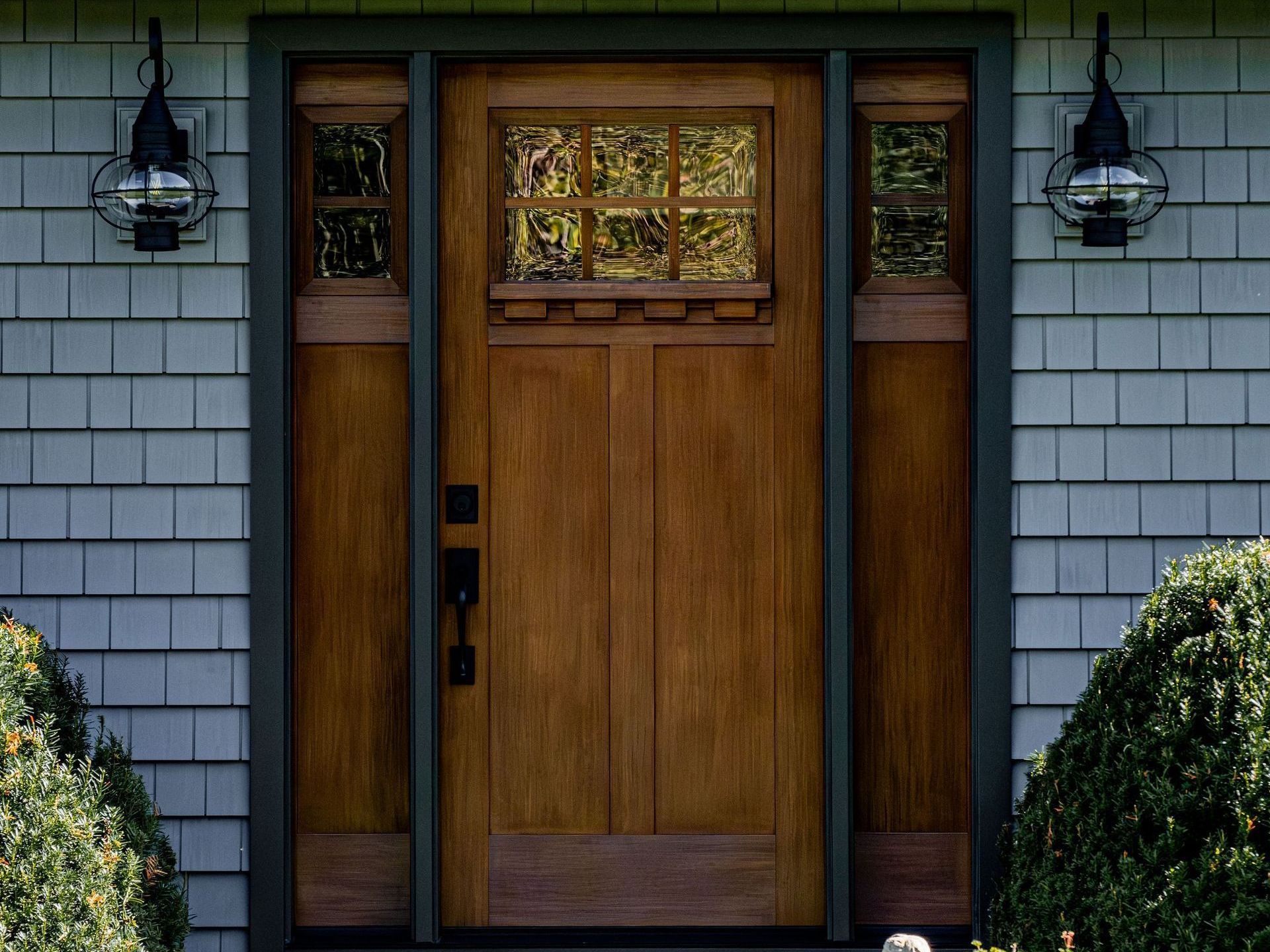 The front door of a house with a wooden door