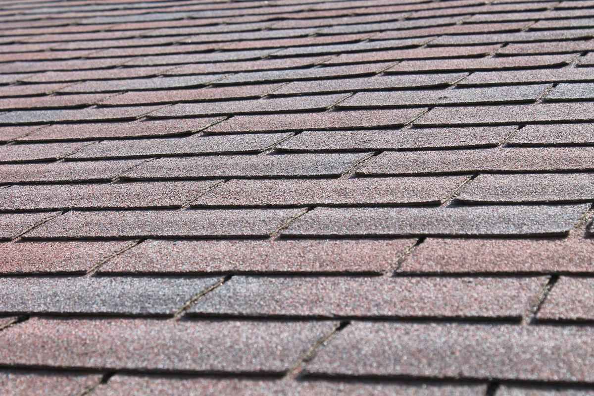 A close up of a roof with shingles on it.