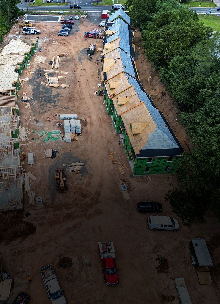 An aerial view of a construction site with a building under construction.