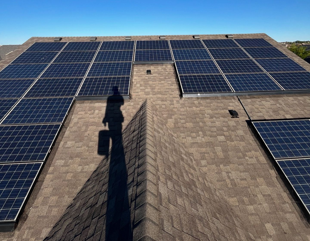 A roof with a lot of solar panels on it