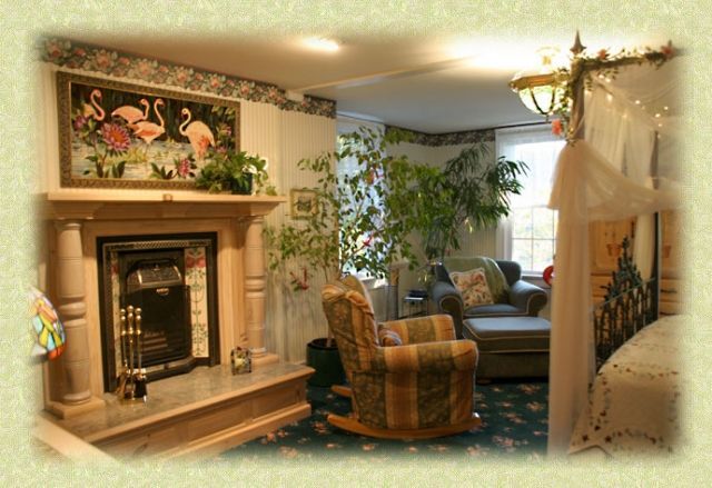 A living room with a fireplace and a rocking chair