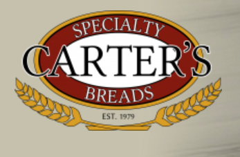 Logo for Carter's Specialty Breads, featuring an oval with text and wheat sprigs, established 1979.