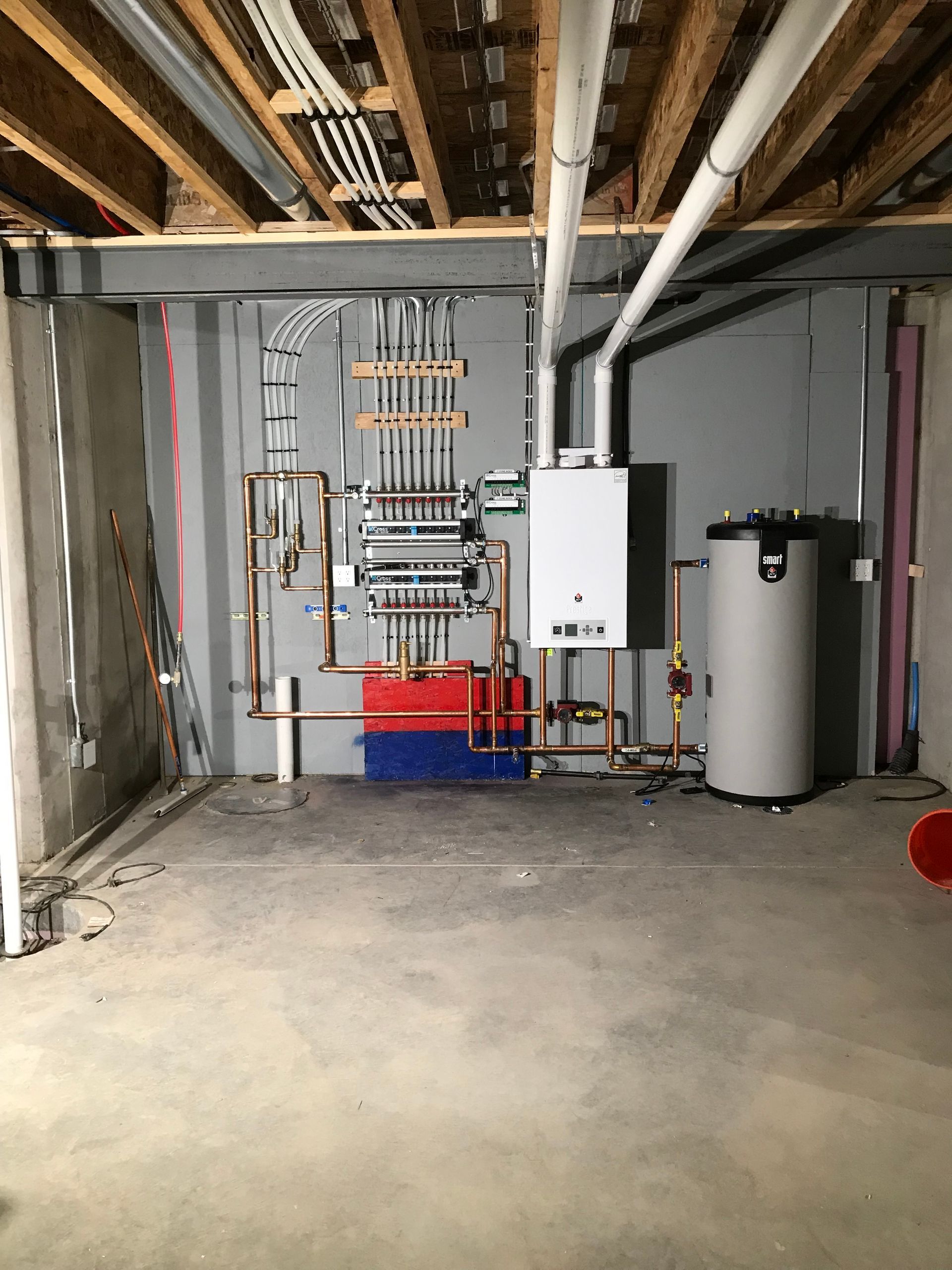 E.Squared Custom Plumbing Heating and Air - Green truck towing a white enclosed trailer on a sunny driveway.