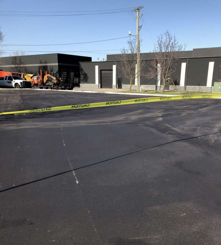 A parking lot with a yellow caution tape around it